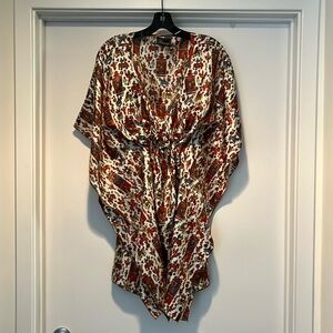 Silk tunic with tie hidden construction detail.